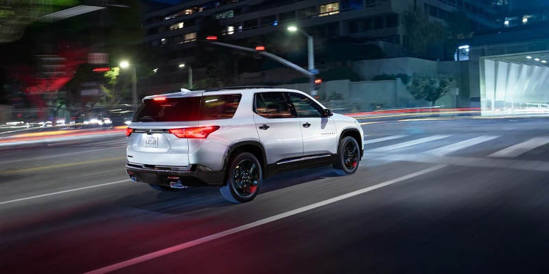 2022 Chevrolet Traverse driving in a lit street at night